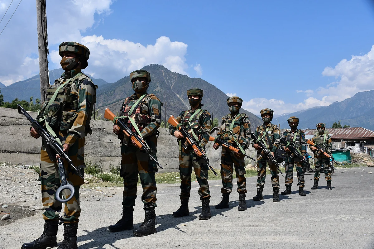 The soldiers guard a checkpoint in Wasun area of Ganderbal district of Kashmir