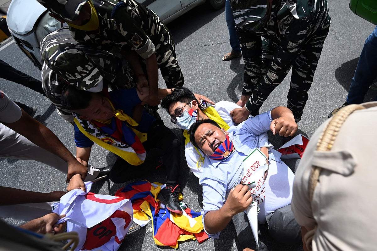 Activists of the Tibetan Youth Congress (TYC) international non-governmental organization shout slogans as they are detained by police during a protest outside the China embassy on the occasion of the 100th anniversary of the founding of the Chinese Communist party, in New Delhi on July 1, 2021.