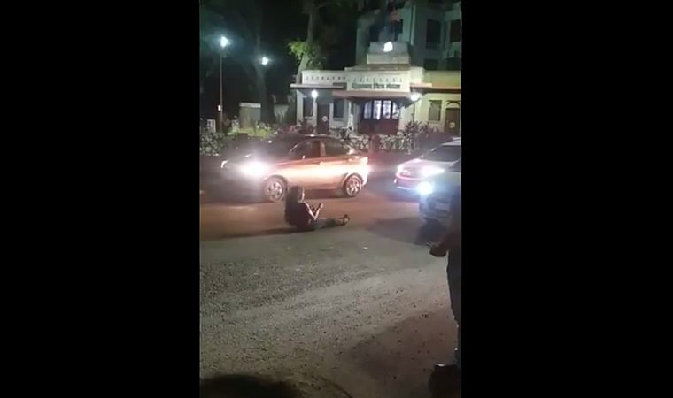 Watch: Intoxicated young woman rolls around on road amidst traffic at Pune's Hirabaug chowk; video goes viral