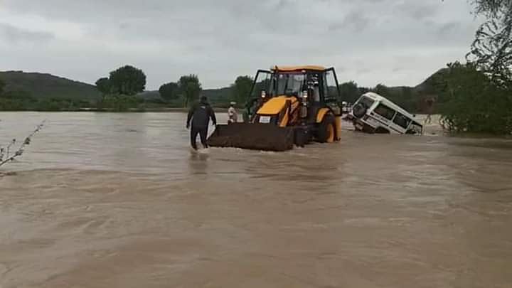 Vehicle stuck in water being towed