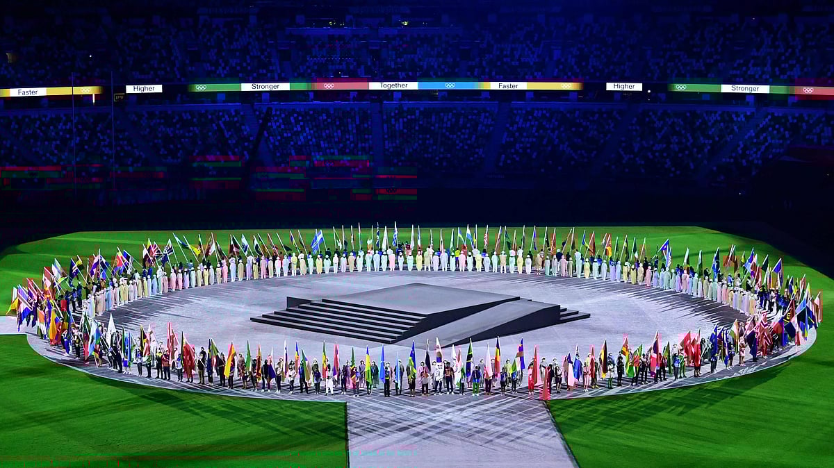 Athletes carrying nations' flags arrive with their national flag during the closing ceremony of the Tokyo 2020 Olympic Games, at the Olympic Stadium, in Tokyo, Japan, on August 8, 2021.
