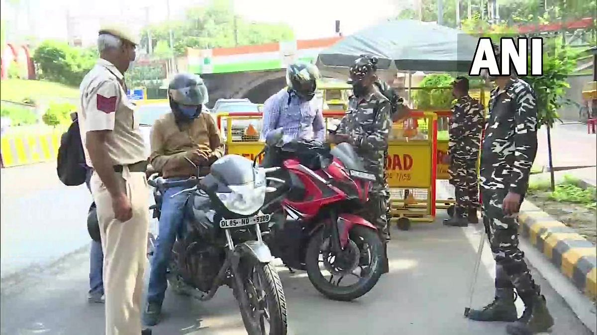 Delhi Police check vehicles and identity cards of commuters as security tightened in the national capital ahead of Independence Day celebrations