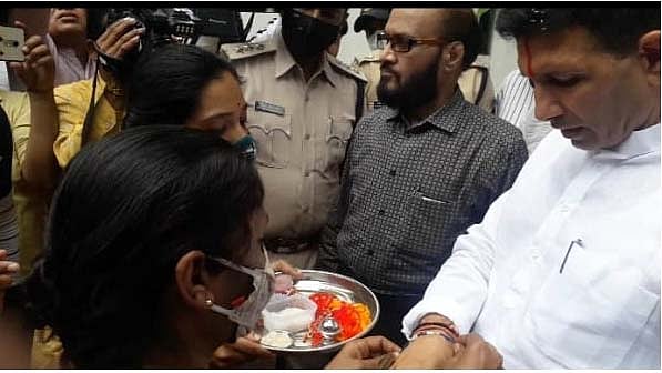 Protesting teachers tie rakhi to Congress MLA Jitu Patwari in Bhopal on Wednesday 
