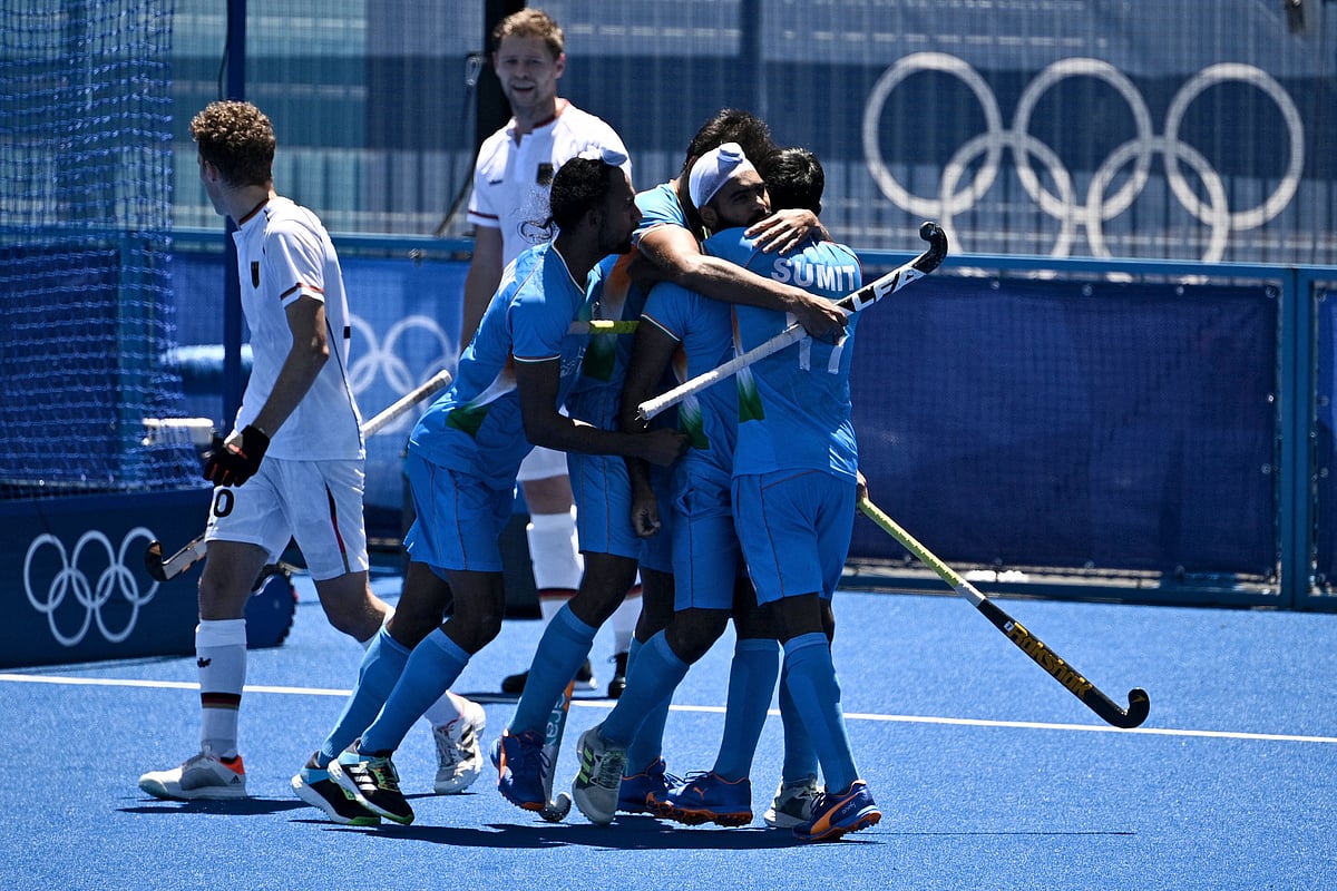 Players of India celebrate after scoring against Germany during the mens bronze medal match of the Tokyo 2020 Olympic Games field hockey competition, at the Oi Hockey Stadium in Tokyo, on August 5, 2021.
