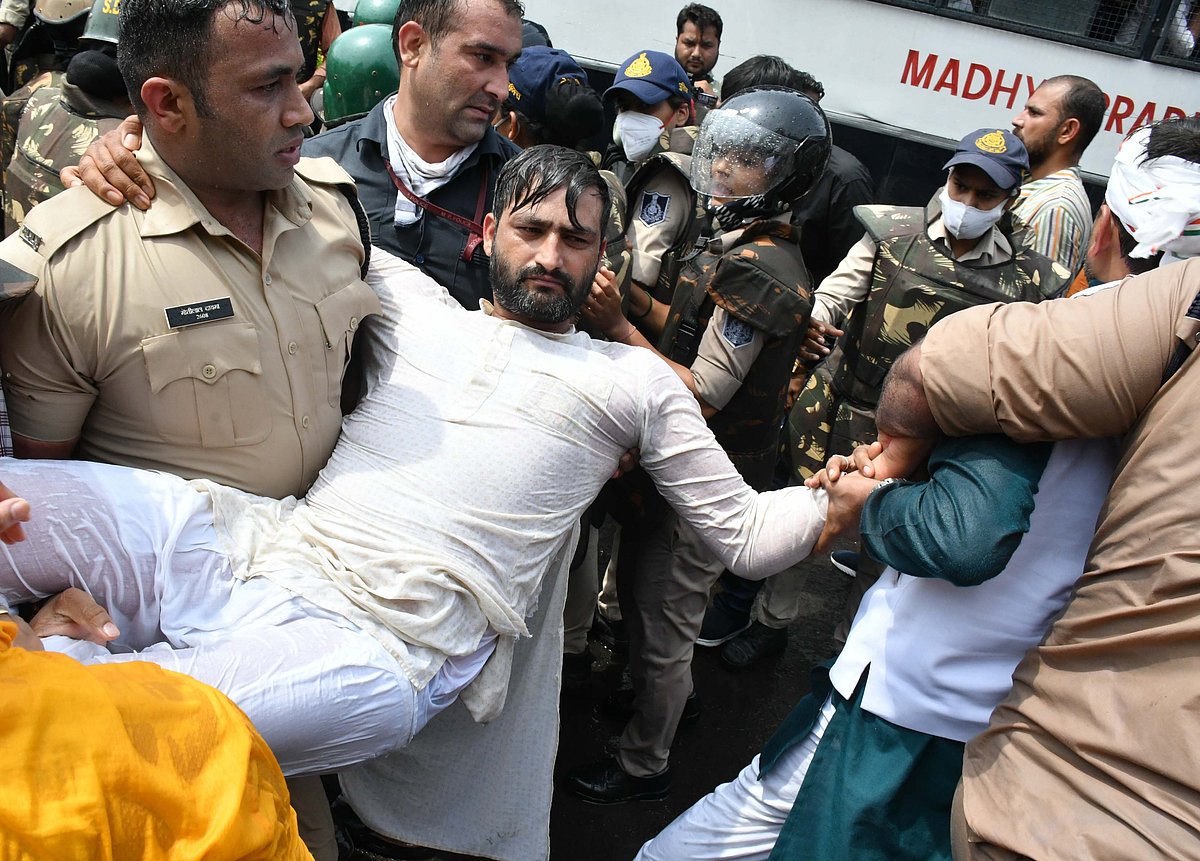 Police carry IYC worker and arrest them as they march towards CM house to gherao on Wednesday. 