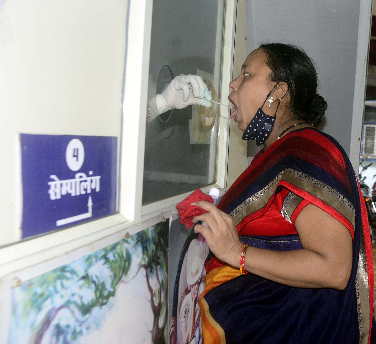 Sample being collected for covid test at fever clinic at JP Hospital in Bhopal on Monday.