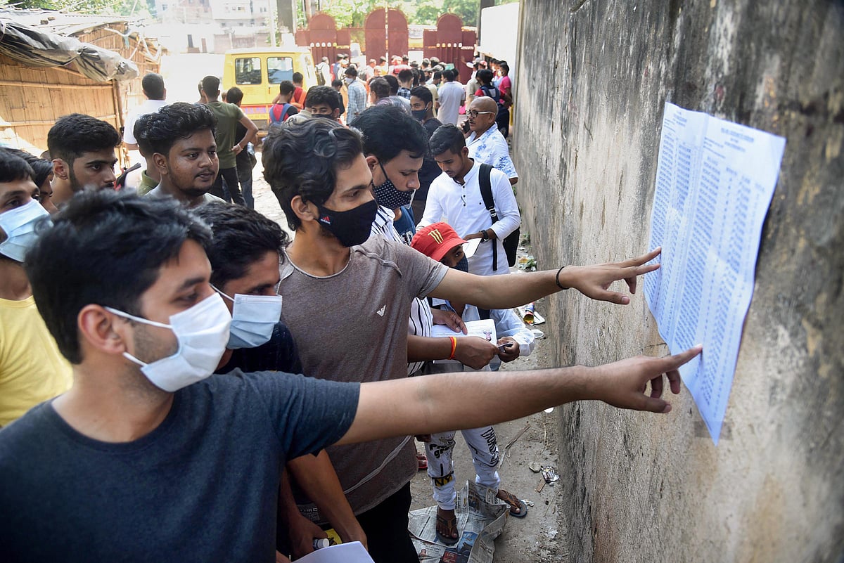 Patna: Aspirants look for their seat number to enter examination center before appearing National Eligibility cum Entrance Test- Undergraduate (NEET UG 2021), in Patna, Sunday, Sept. 12, 2021.