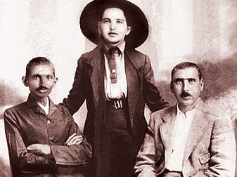 Gandhi with office colleagues, Kallenback and Sonja Schlesin.