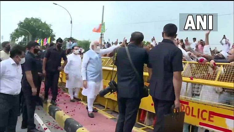 PM Modi returns to New Delhi after concluding three-day visit to US, greets supporters at airport; see pics