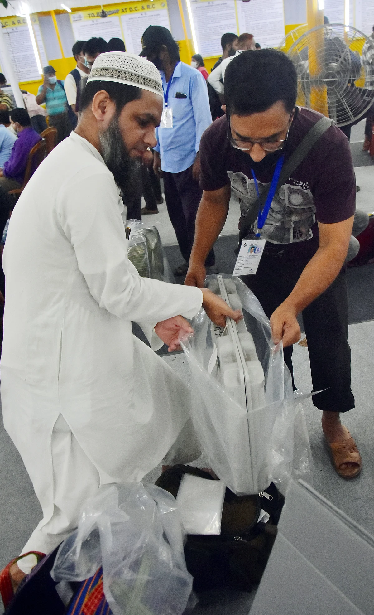 West Bengal, Sep 29 (ANI): Polling officials put an Electronic Voting Machine (EVM) inside a plastic bag to protect it from rainfall to be taken to the polling booth on the eve of the Bhabanipur by-election, in Kolkata on Wednesday.