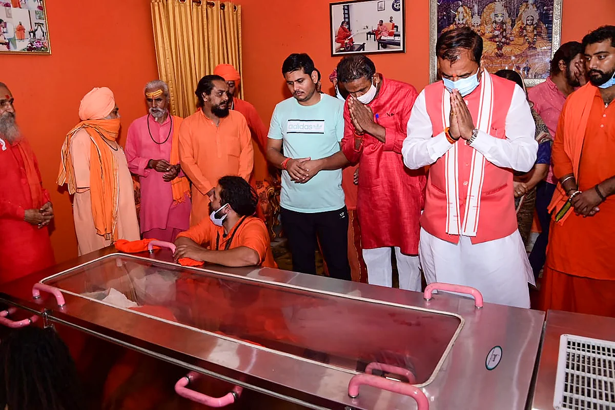 Uttar Pradesh Deputy CM Keshav Prasad Murya pays last respect to Akhada Parisad President Mahant Narendra Giri, at Bagambhari Math in Prayagraj, Tuesday, Sept. 21, 2021.