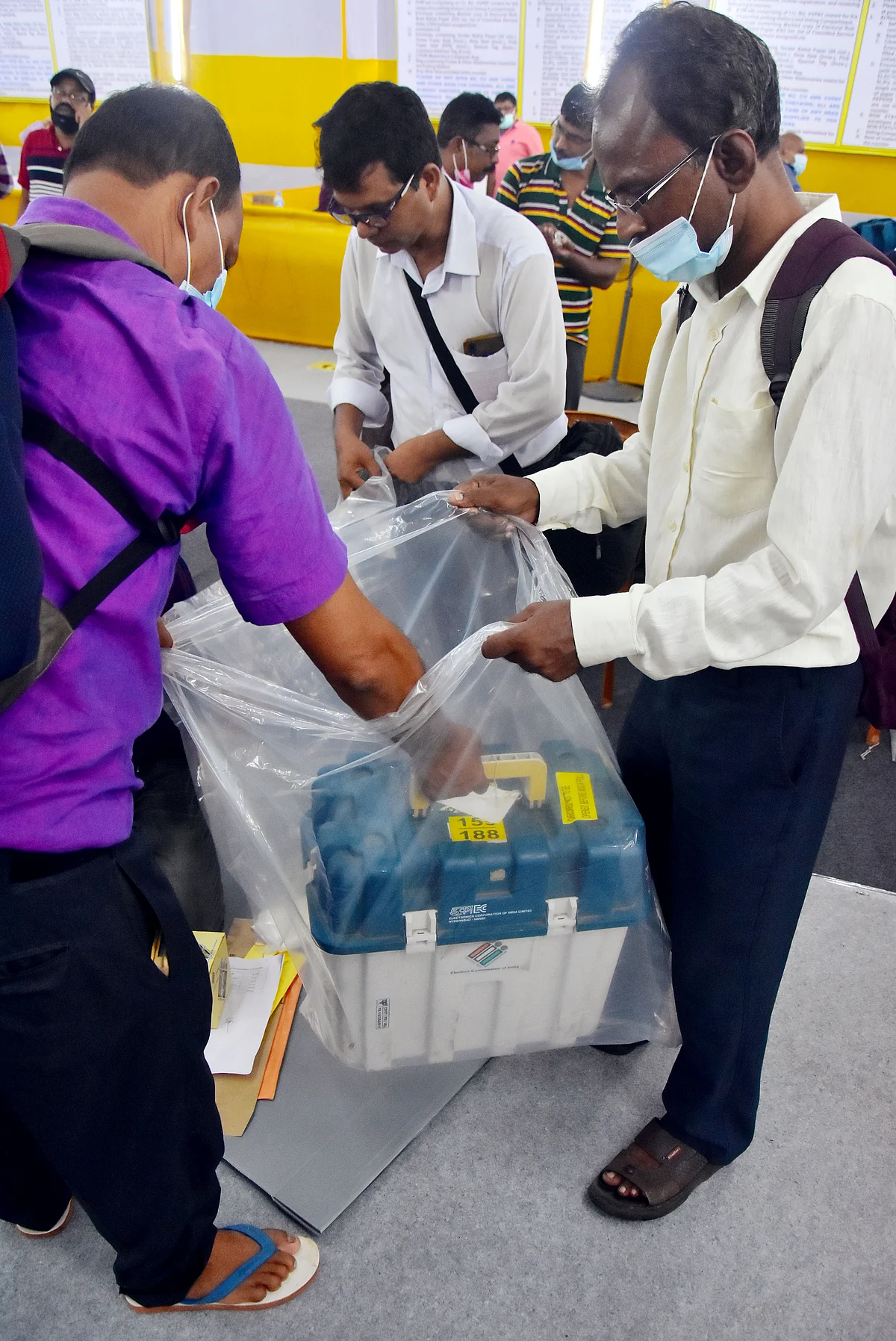 West Bengal, Sep 29 (ANI): Polling officials put an Electronic Voting Machine (EVM) inside a plastic bag to protect it from heavy rainfall to be taken to the polling booth on the eve of the Bhabanipur by-election, in Kolkata on Wednesday.