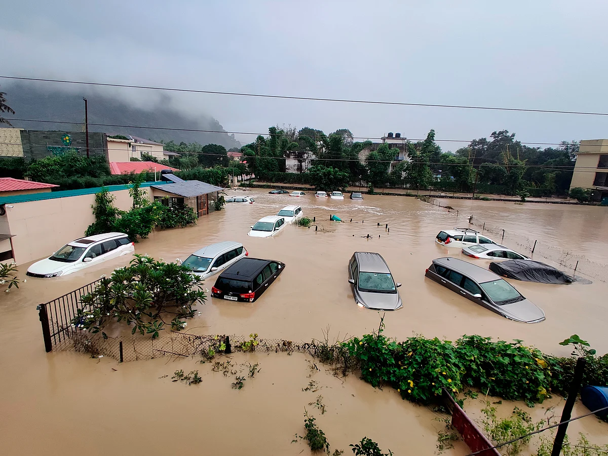 Uttarakhand: Submerged cars are seen at a flooded hotel resort as extreme rainfall caused the Kosi River overflow at the Jim Corbett National Park in Uttarakhand, India, Tuesday, Oct.19, 2021.