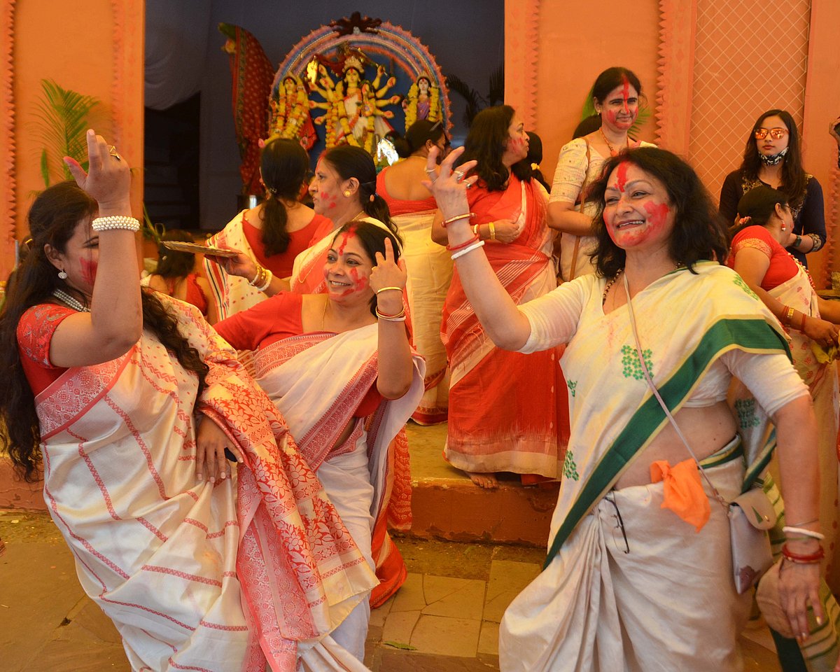 Female members of the Bengali Association Bhopal participate in Sindoo Khela at Durga Pandal, Kali Bari , TT Nagar Bhopal on Friday