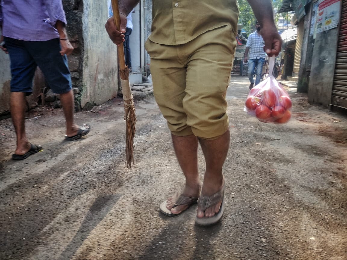 A man going about his day at Dharavi, Mumbai.