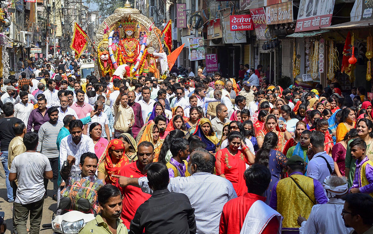 People participate in the Chal Samaroh procession on the occasion of Dussehra, in Jabalpur, Friday, Oct. 15, 2021.
