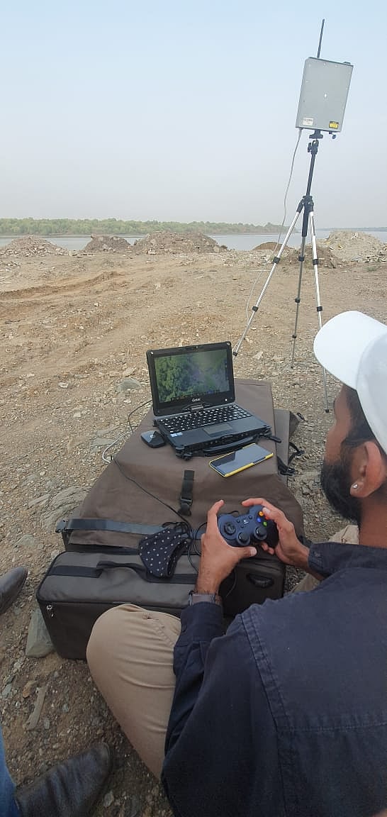 A team member operation the drone