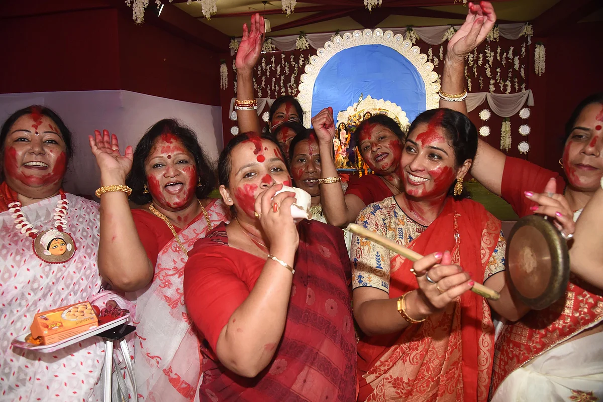 Women participate in Sindoor Khela at a puja pandal on the last day of Durga Puja celebrations in Patna, Friday, Oct. 15, 2021.