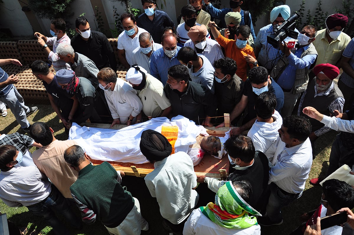 Relatives and neighbors carry the body of prominent pharmacist Makhan Lal Bindroo during his funeral at his residence in Srinagar,Kashmir. Bindroo, a Kashmiri Hindu and two other civilliana were killed by Suspected militants in separate attacks on last evening.