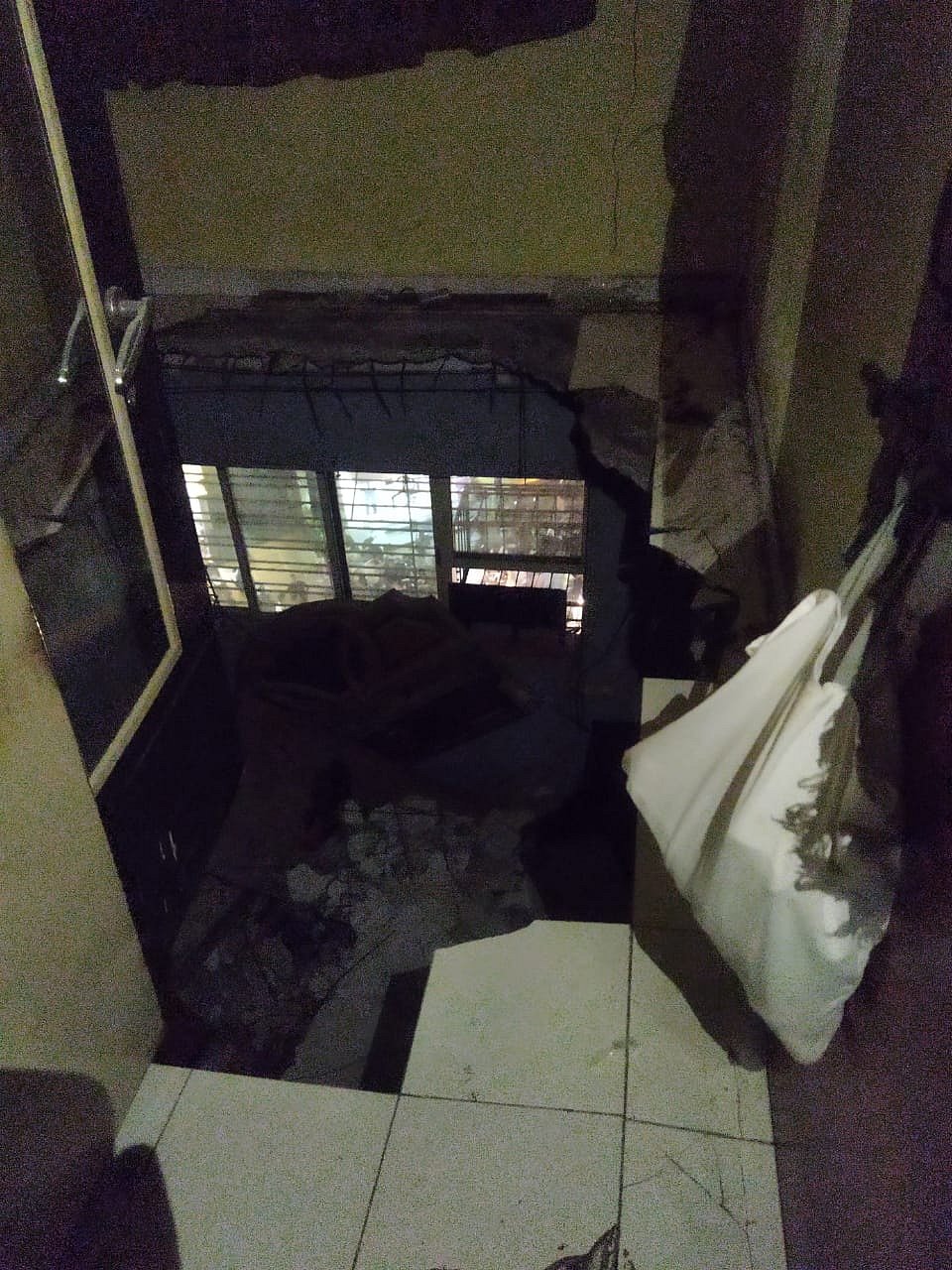 The bedroom slab of room number 503 fell on the bedroom of room number 403