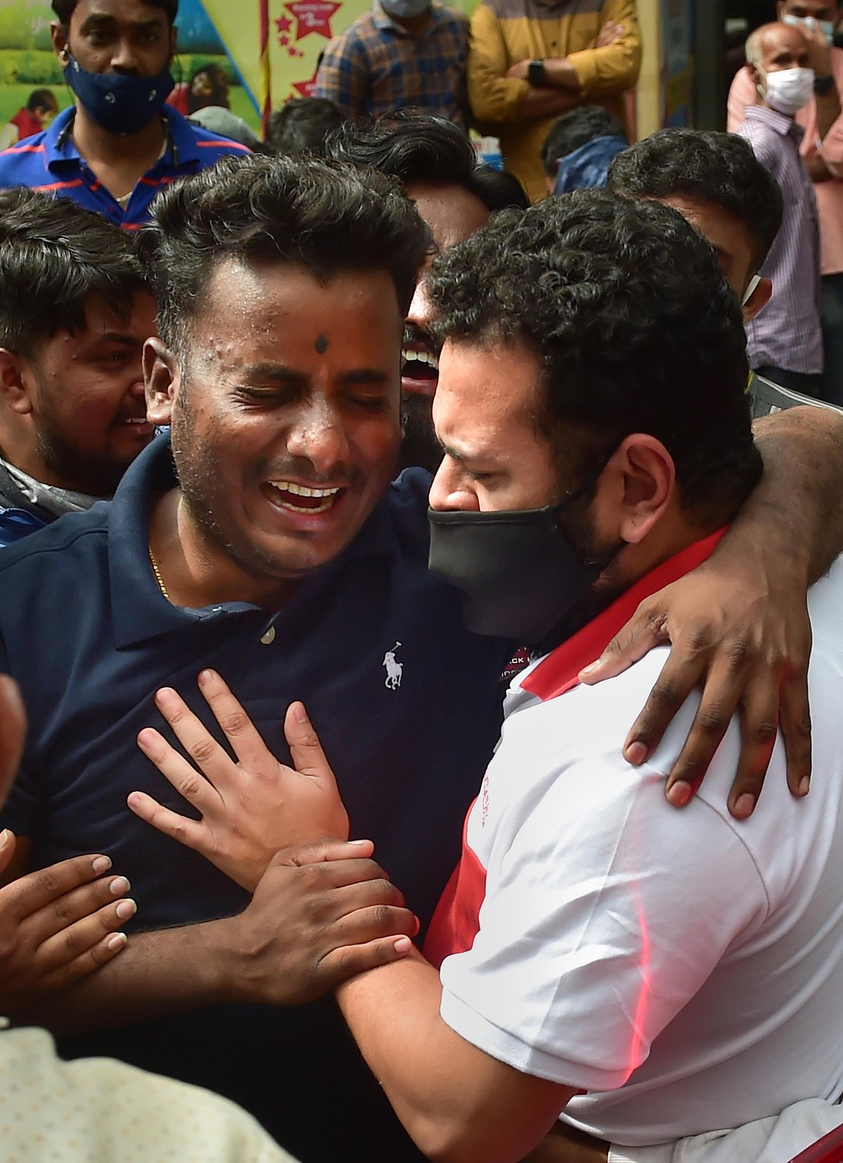 Bengaluru: Fans mourn as they gather outside the Vikram Hospital to catch a glimpse of Kannada superstar Puneeth Rajkumar, who passed away due to a fatal cardiac arrest, in Bengaluru, Friday, Oct. 29, 2021. He was 46.