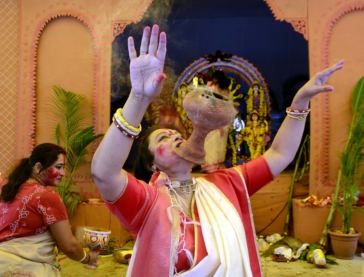 Female members of the Bengali Association Bhopal participate in Sindoo Khela at Durga Pandal, Kali Bari , TT Nagar Bhopal on Friday