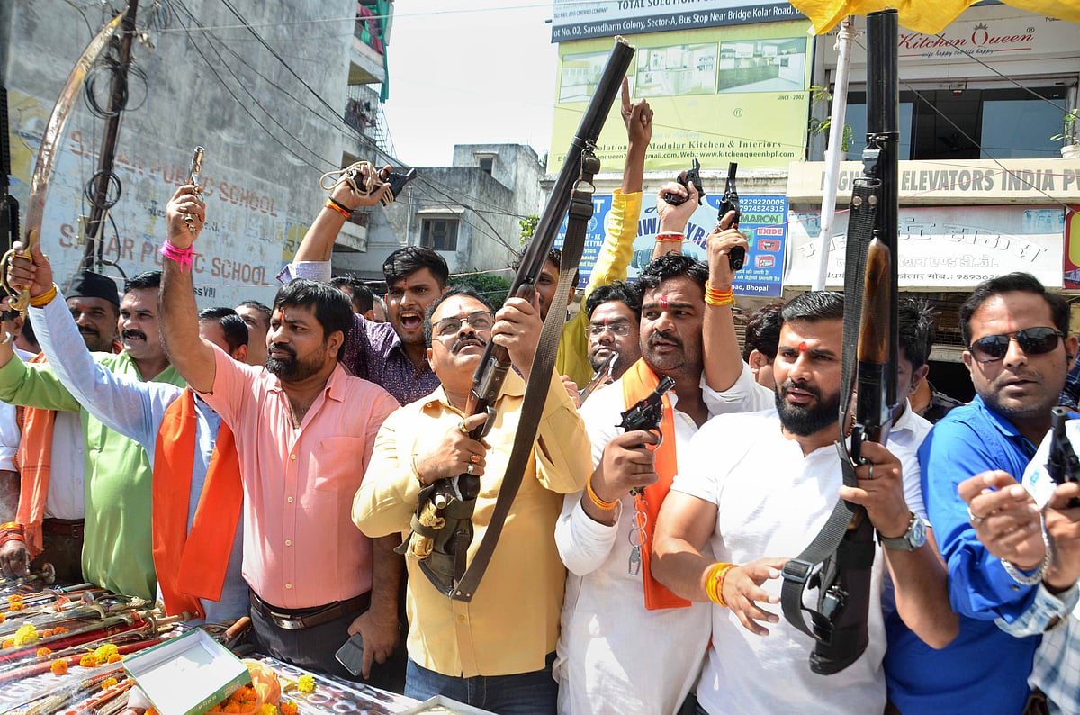 Members of Hindu Utsav Samiti display their weapons after performing Shastra Puja on the occasion of Dussehra festival in Bhopal, Friday, Oct. 15, 2021.