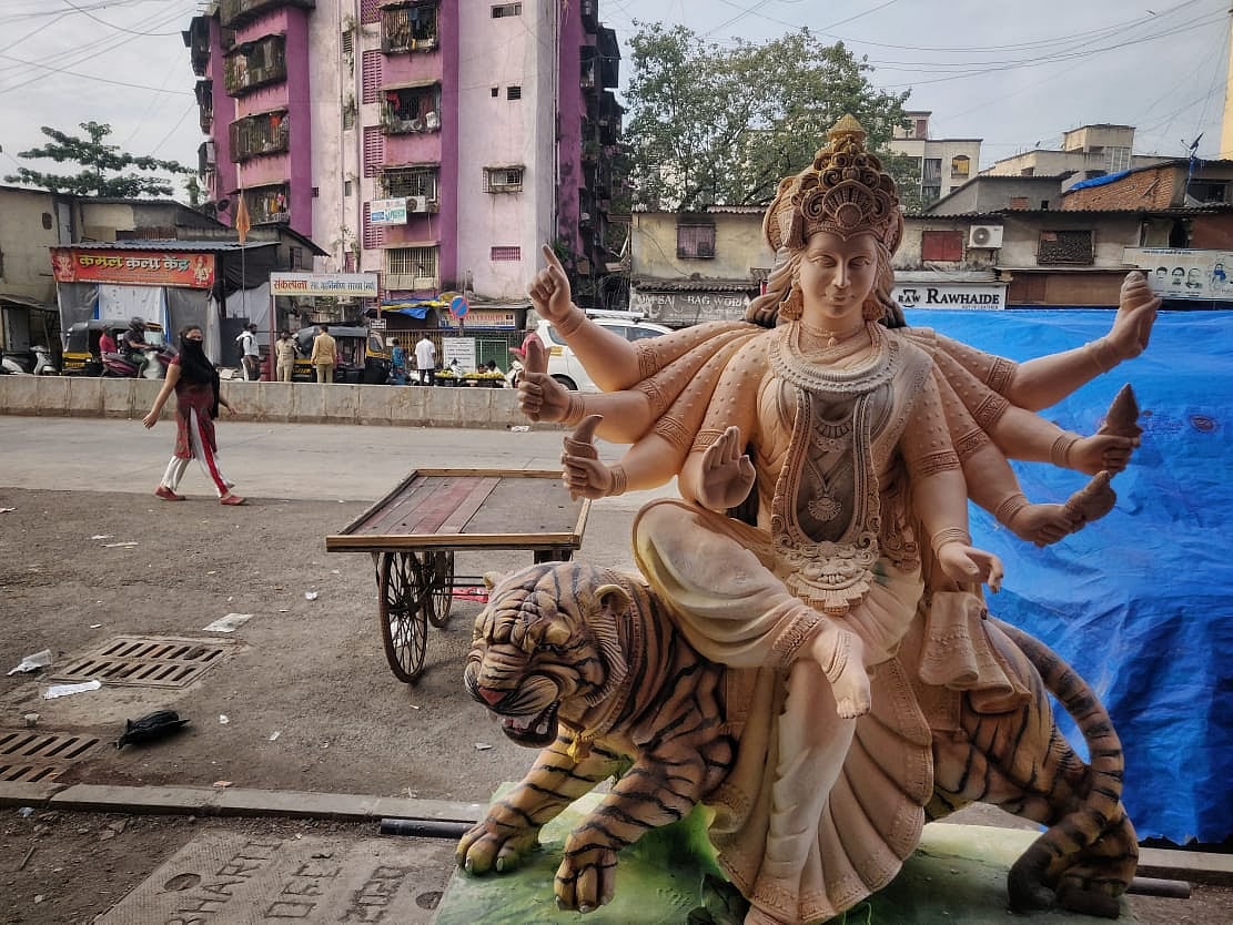 An idol of a Hindu goddess Durga stands by a road in Dharavi, Mumbai on Tuesday, October 5, 2021.