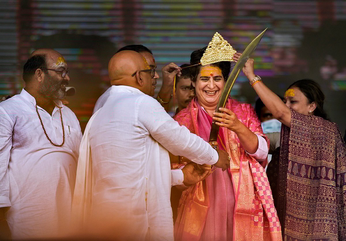 Varanasi: Congress General Secretary Priyanka Gandhi being feliciated during Kisan Nyay rally, ahead of UP Assembly Elections 2022, in Varanasi, Sunday, Oct. 10, 2021.