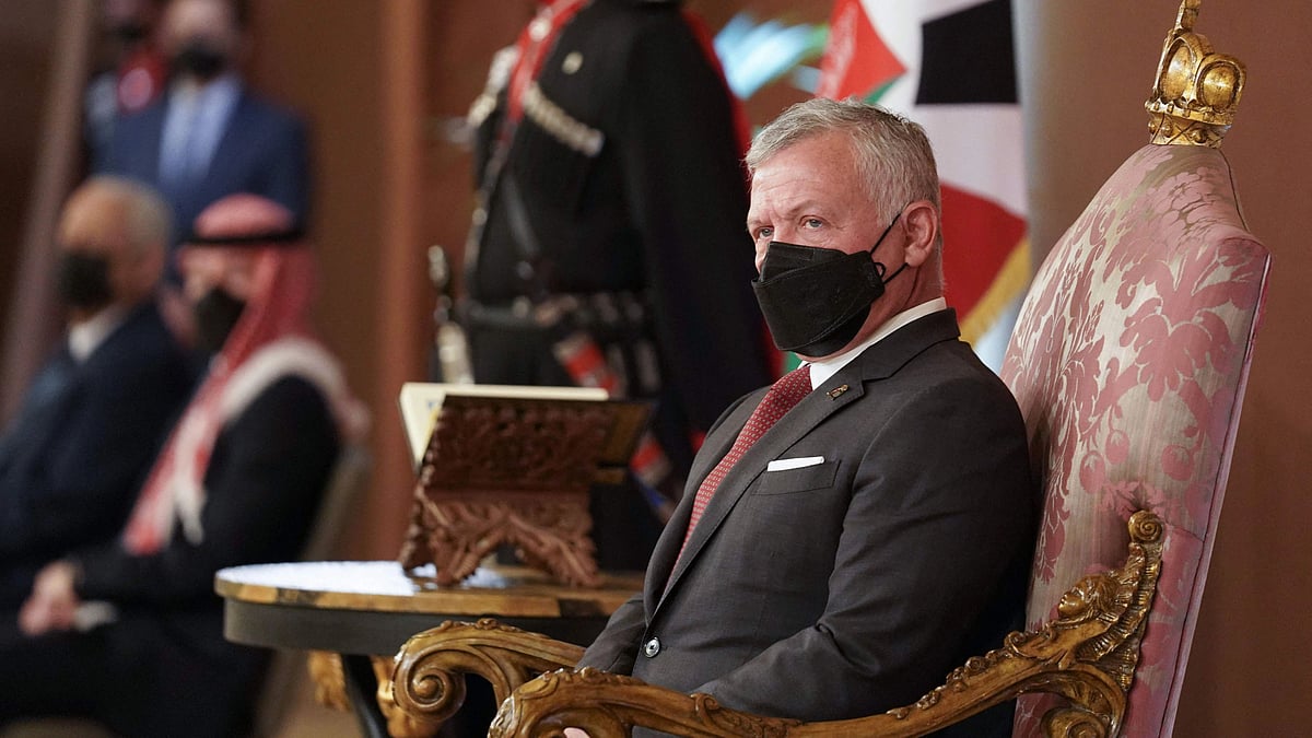 A handout picture released by the Jordanian Royal Palace shows Jordans King Abdullah II (R) meeting with parliament members in the capital Amman on November 28, 2021  | (Photo by Yousef ALLAN / Jordanian Royal Palace / AFP) /