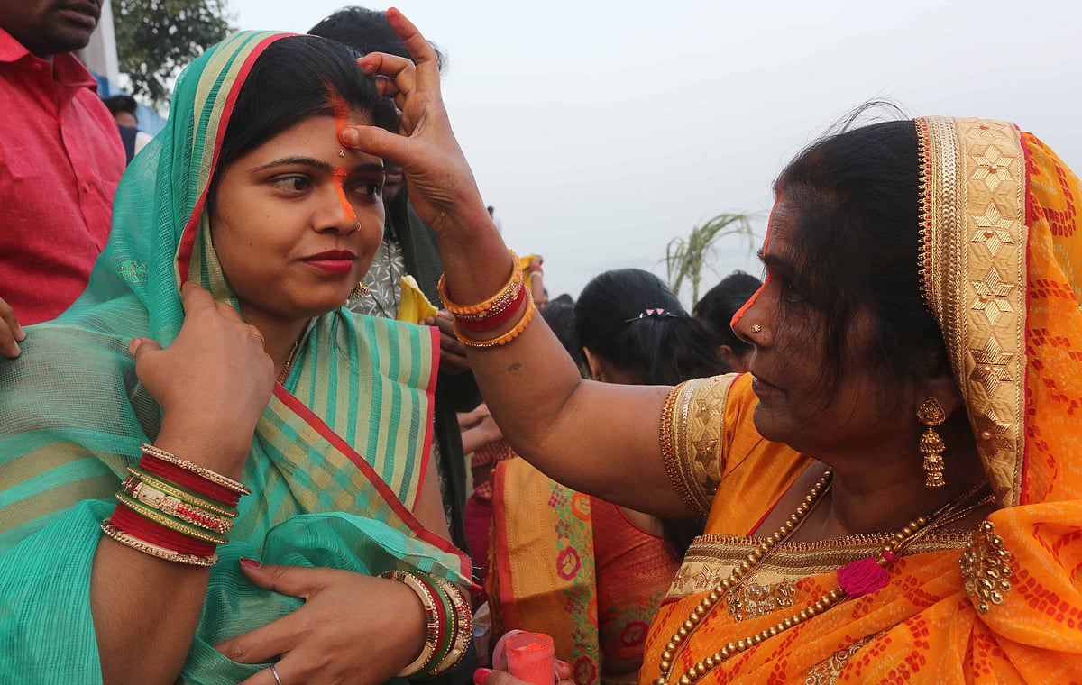 women performing rituals during Chhath Puja at Sheetal Das Ki Bagia, Upper Lake, on Thursday.