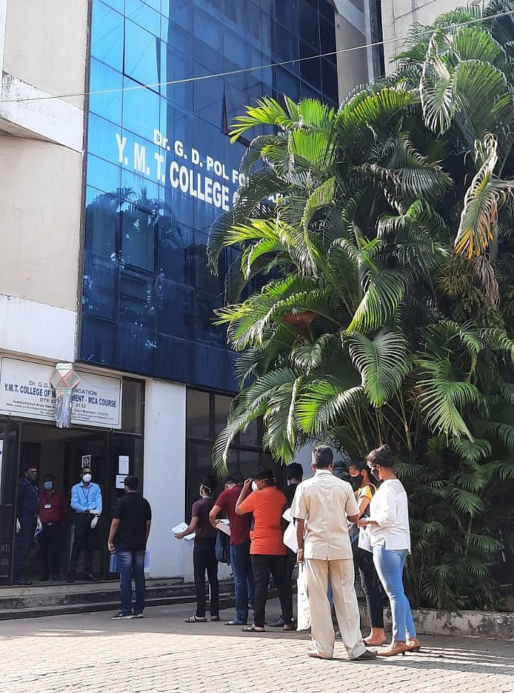 Students queue up outside YMT College of Management, Kharghar
