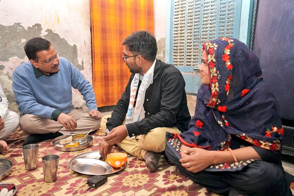 Arvind Kejriwal eats dinner with auto driver Dilip Tiwari, invites his family for dinner in Delhi; see pics
