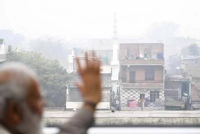 PM Modi waves at Kanpur residents while his new Metro travel