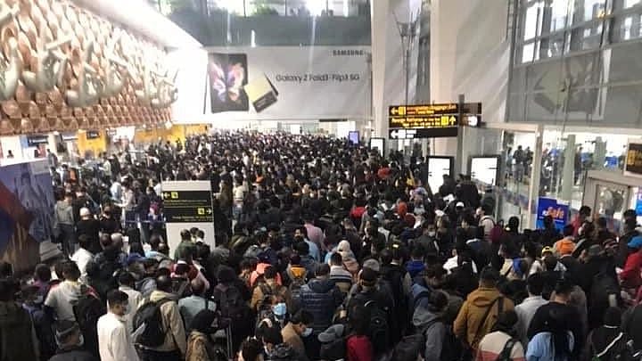 See pics: Rush at Delhi airport as passengers wait for long hours in crowded spaces to get themselves tested for COVID-19 under new Omicron rules
