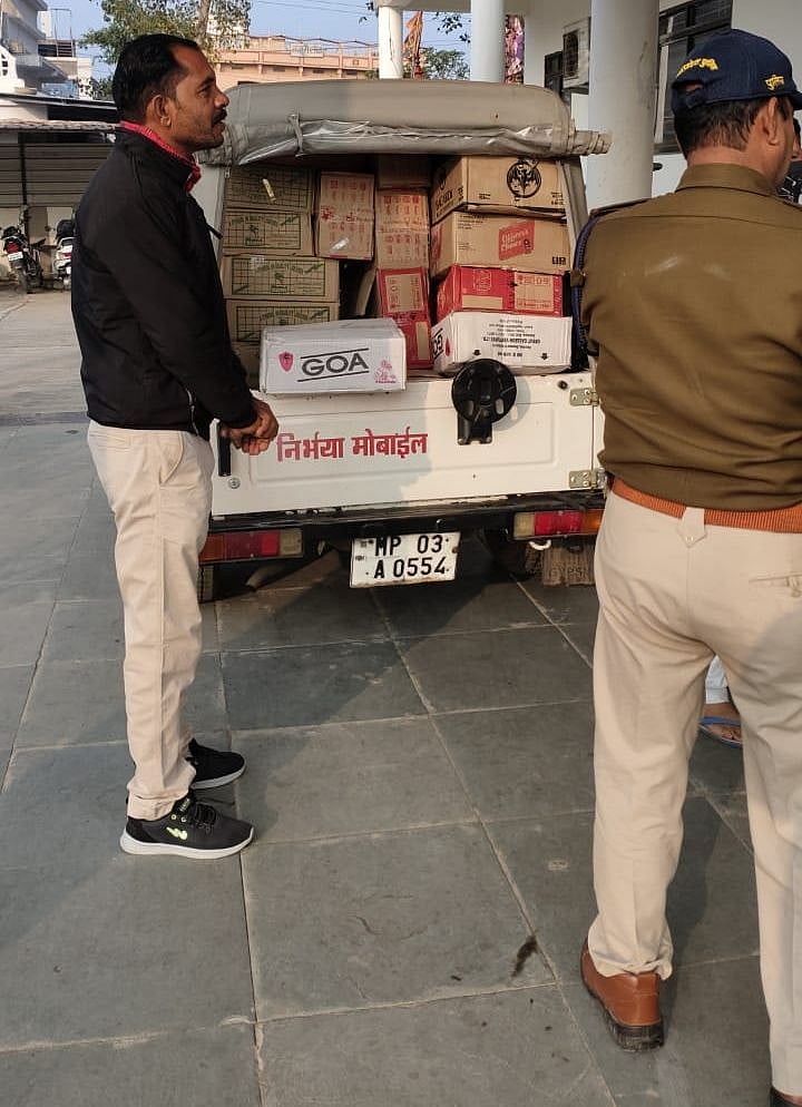 Policemen confiscating liquor