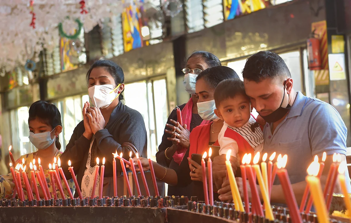 Bengaluru: Devotees offer prayers at St Basilica Church, on the eve of Christmas festival in Bengaluru, Friday, Dec. 24, 2021.