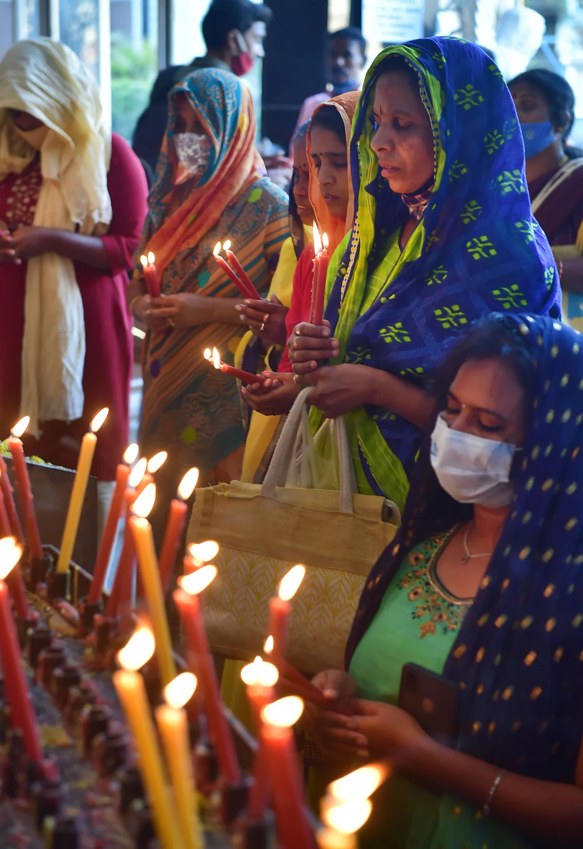 Bengaluru: Devotees offer prayers at St Basilica Church, on the eve of Christmas festival in Bengaluru, Friday, Dec. 24, 2021.