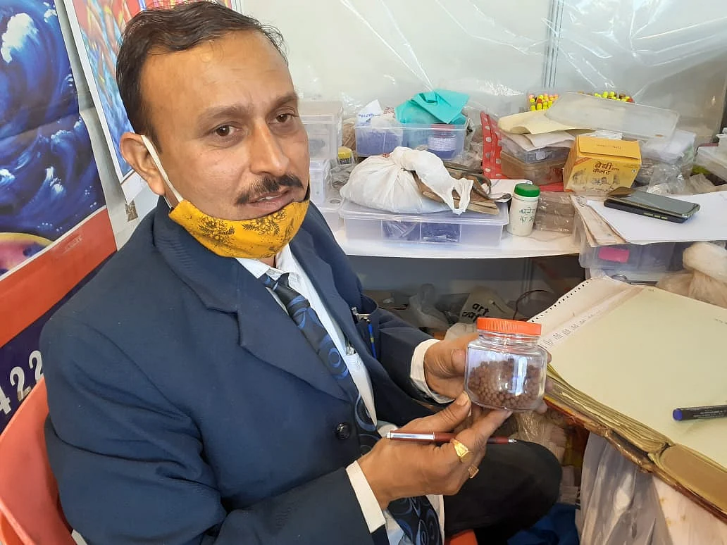 Vaidya Santosh Anand Jaiswal showing ( stall no. 1, Shushrut Dome) the medicine for Covid-19 patients at International Van Mela at the Lal Parade Ground in the city.