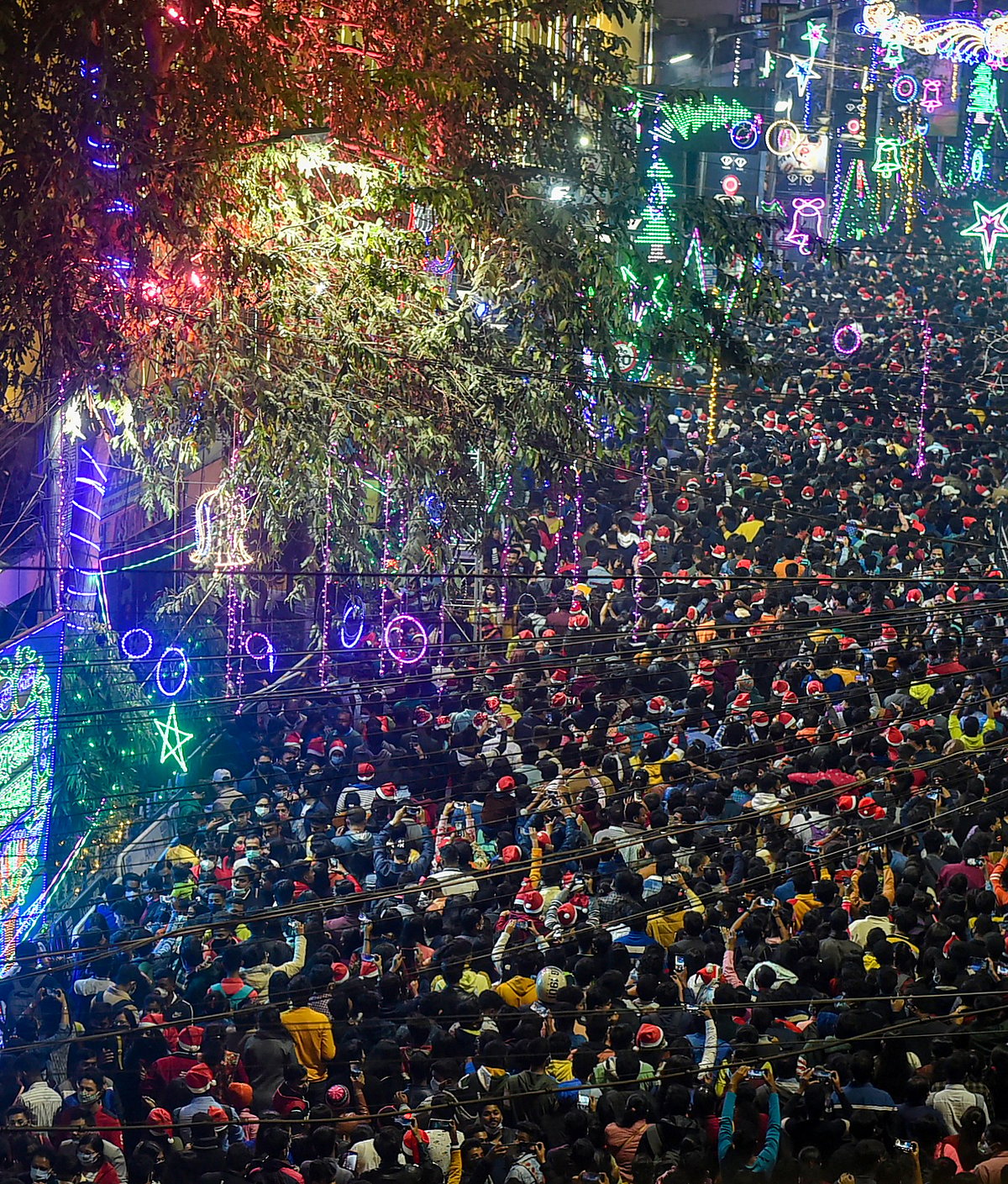Kolkata: People gather at Park Street to celebrate Christmas day in Kolkata, Saturday, Dec. 25, 2021.
