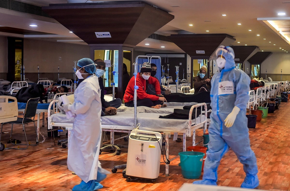 COVID-19 patients undergo treatment inside the Shehnai Banquet Hall, a COVID-19 care facility, in New Delhi, Thursday, Jan. 20, 2022. | PTI