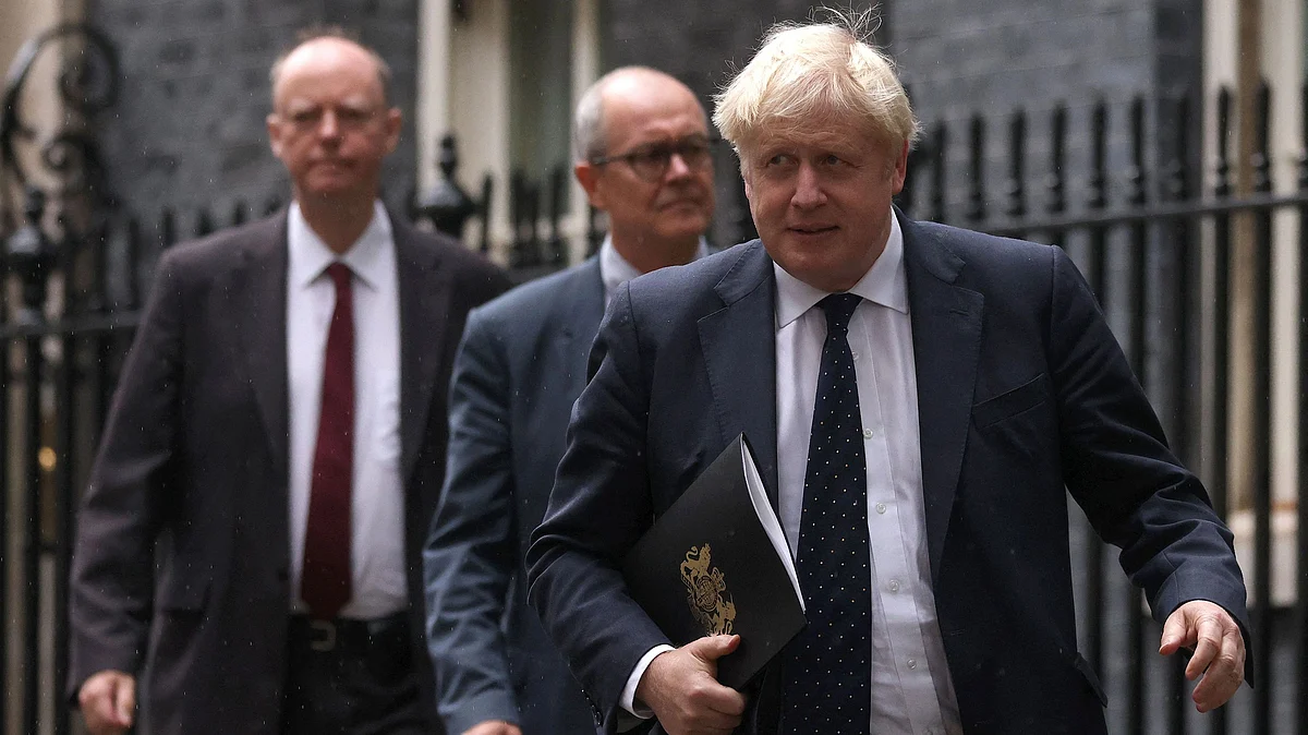 Britains Prime Minister Boris Johnson (R) | AFP