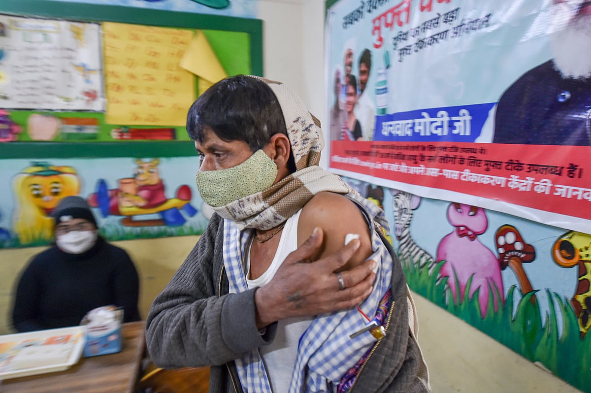 New Delhi: A man receives a dose of COVID-19 vaccine at a school amid concern over rising Omicron cases, in New Delhi, Friday, Jan. 14, 2022.  | (PTI Photo/Arun Sharma)