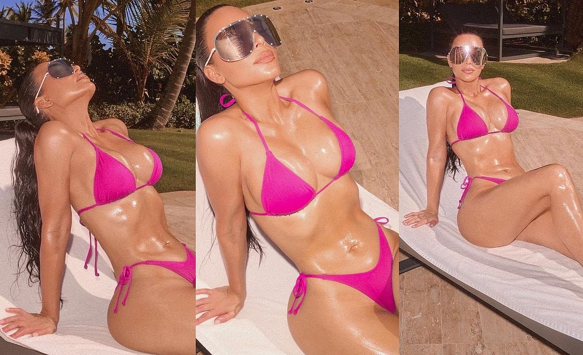 Sexy Kim Kardashian oils up her svelte figure to sunbathe in a skimpy bikini