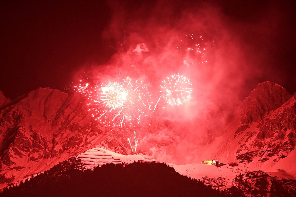 Fireworks are seen early on New Years day in front of the Alps mountains Northern Range (Nordkette) near Innsbruck, Austria, early on January 1, 2022. 