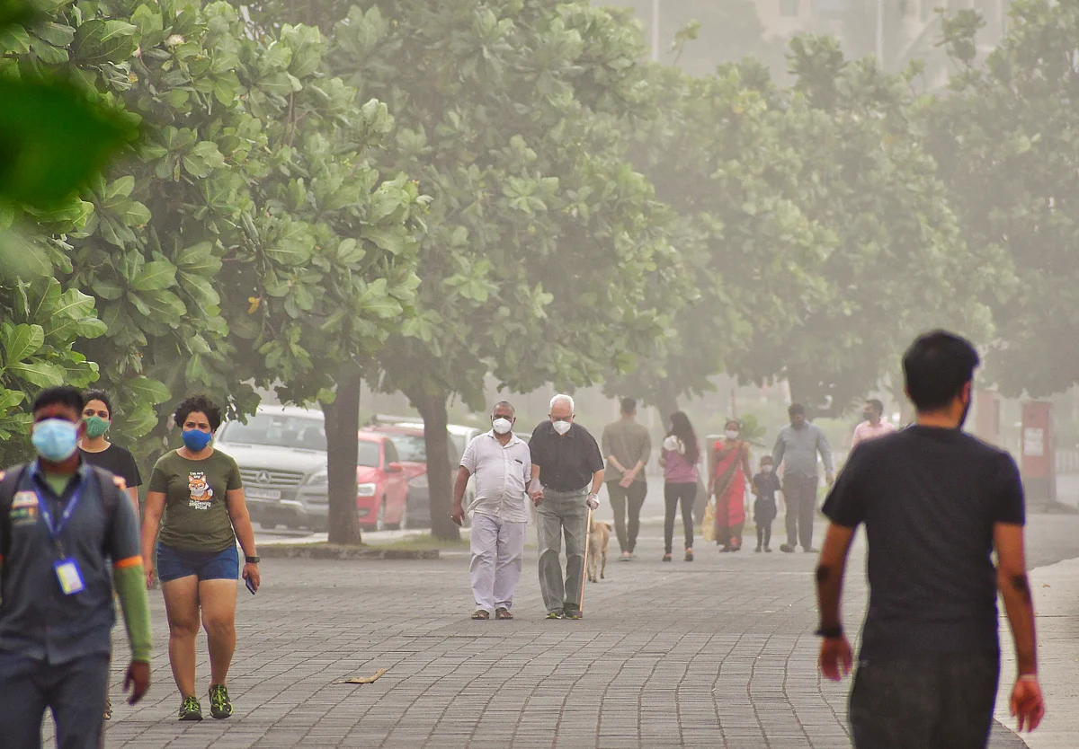 Citizens walking at Marine lines today morning unseasonal rains lashed city yesterday