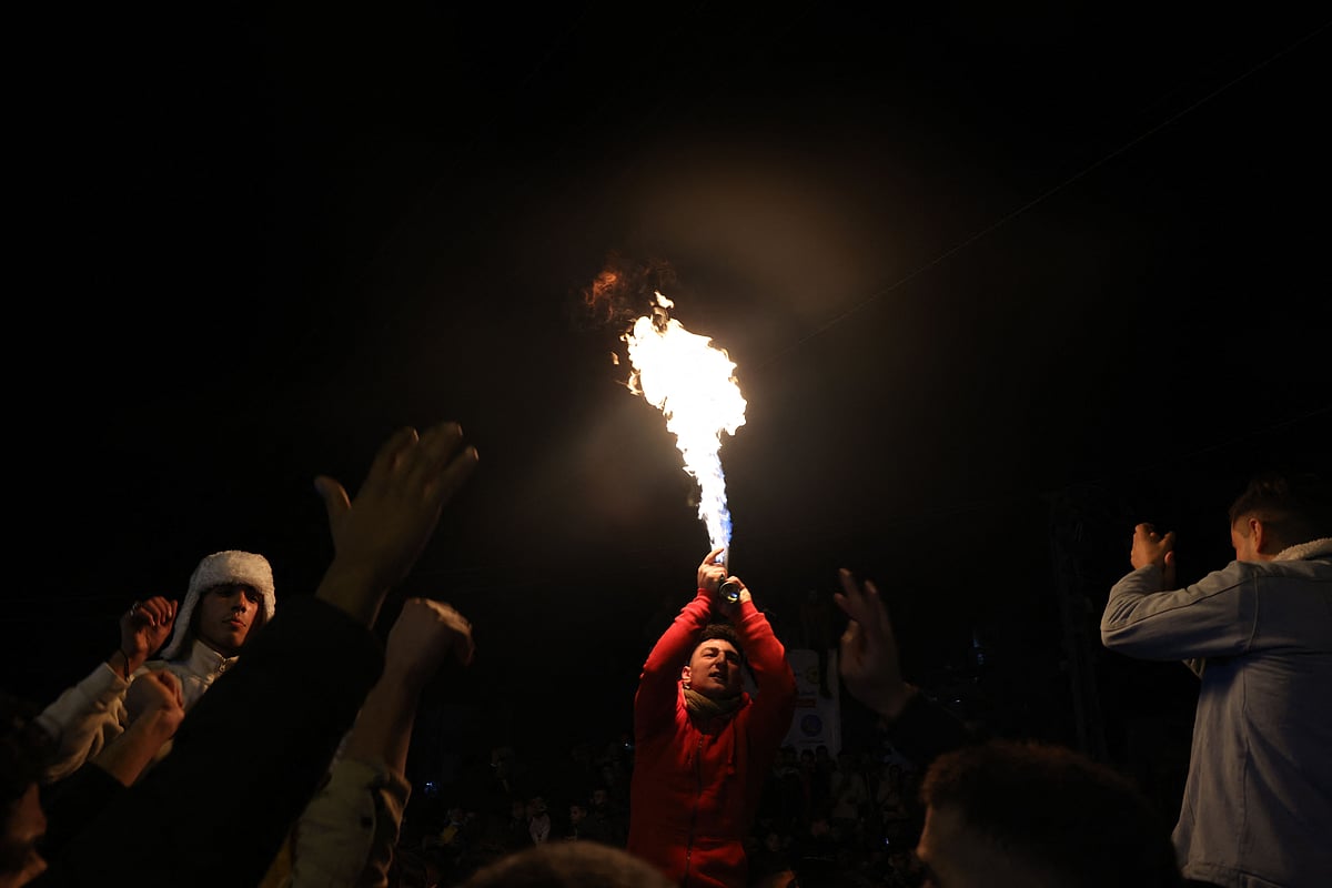 Palestinian people celebrate New Years Eve at Unknown Soldier Square, amid the coronavirus disease (COVID-19) pandemic, in Gaza City, on January 1, 2022. 