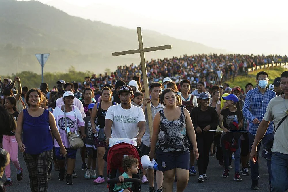 Migrants leave Huixtla, Chiapas state, Mexico, Oct. 27, 2021, as they continue their trek north toward Mexico's northern states and the U.S. border | AP