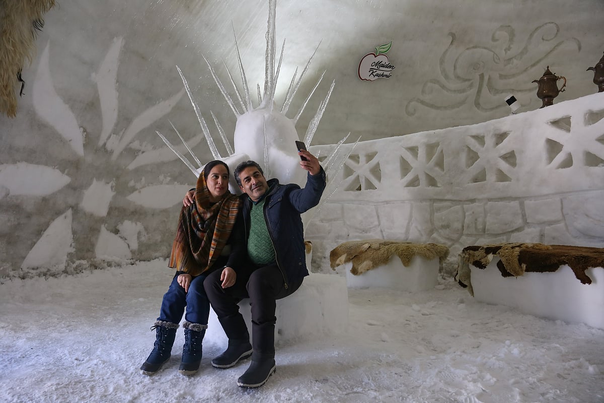 A couple takes selfie inside World's biggest Igloo Cafe made of snow in Gulmarg, Kashmir.