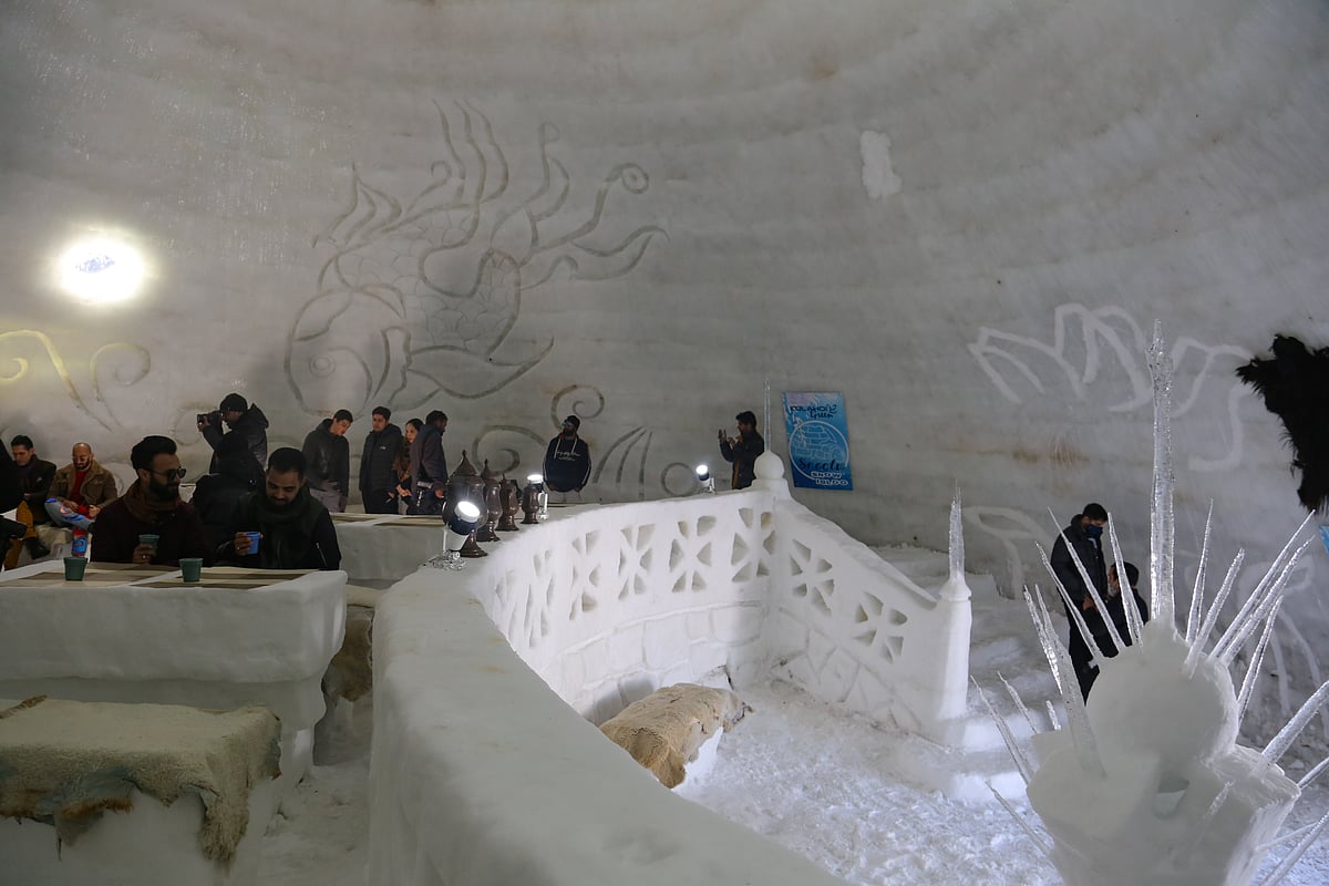 Visitors rest inside Asia's biggest Igloo Cafe made of snow in Gulmarg, Kashmir.